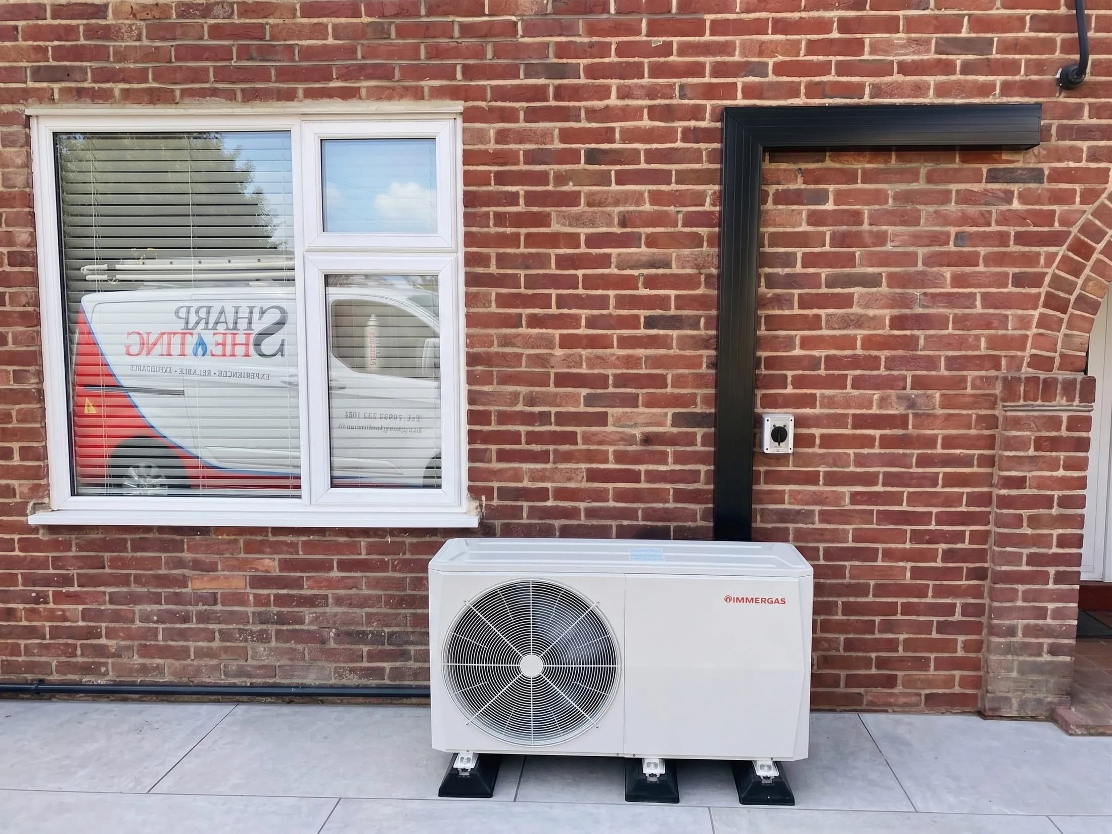 Immergas air source heat pump installed against brickwork in St Albans