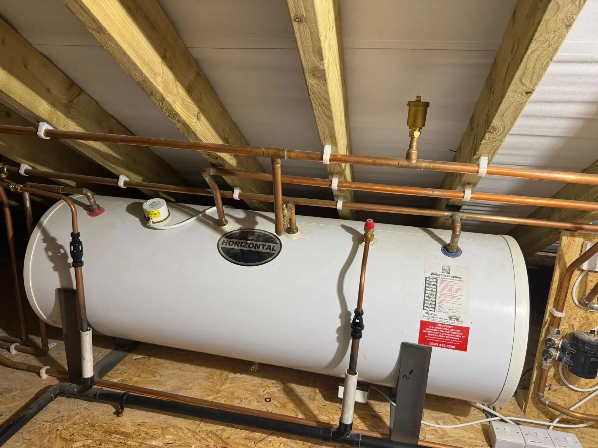 Telford horizontal stainless unvented hot water cylinder installed in Broxbourne