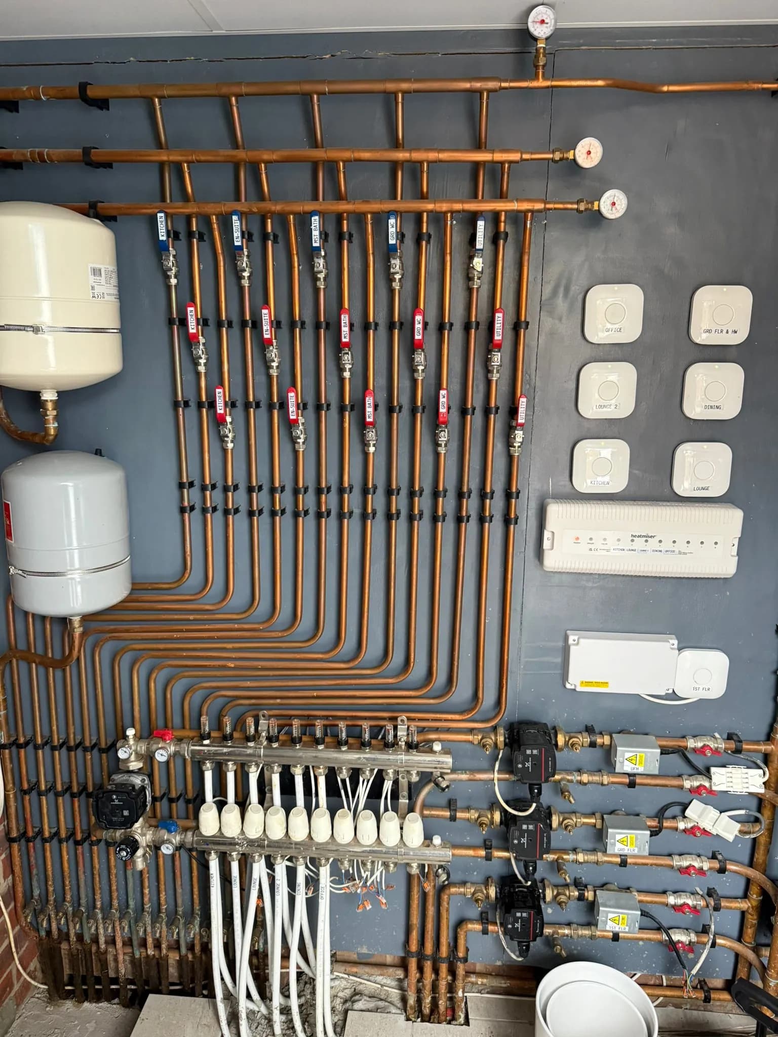 Copper pipework and manifold for multi-zone underfloor heating in Broxbourne